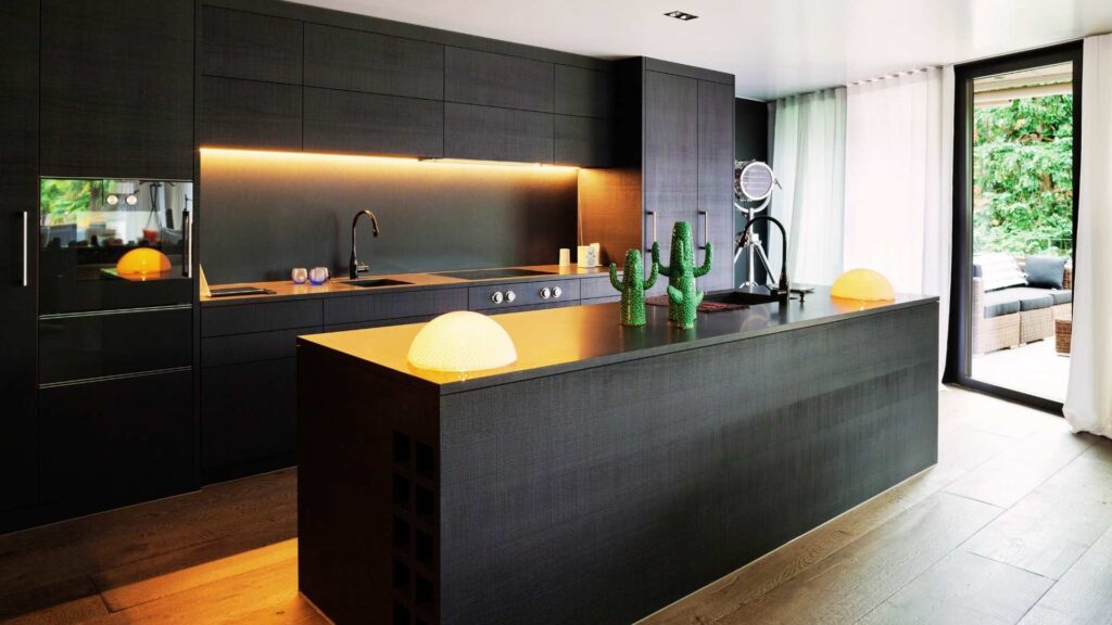 Mosman NSW, Modern kitchen with dark cabinets and island.